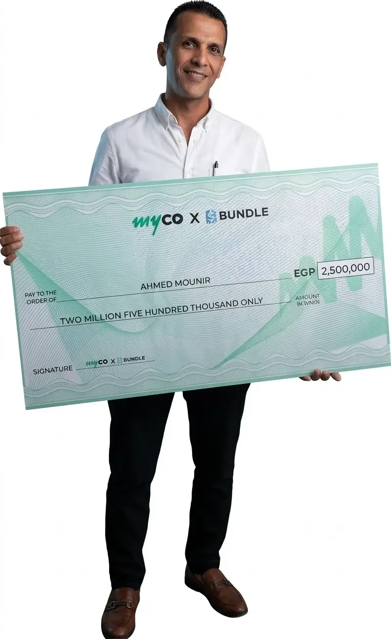 Ahmed M holding the Bundle prize cheque